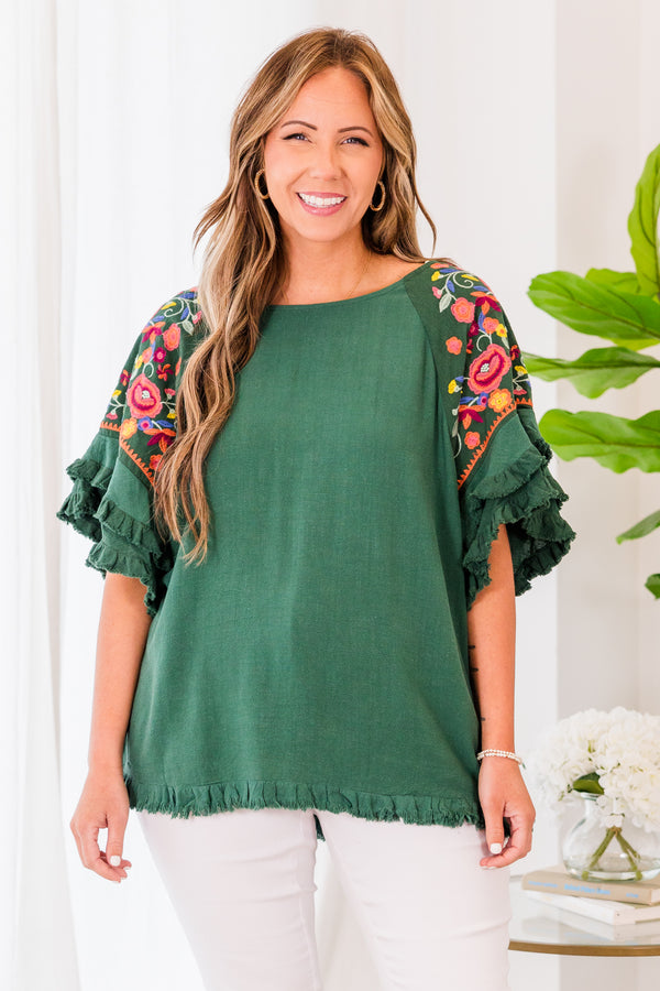 Chic Soul plus size clothing, short sleeve forest green top with ruffled bottom and sleeves with pink floral details on the sleeves