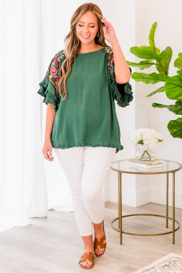 Chic Soul plus size clothing, short sleeve forest green top with ruffled bottom and sleeves with pink floral details on the sleeves