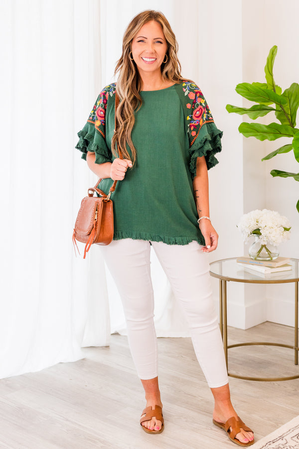 Chic Soul plus size clothing, short sleeve forest green top with ruffled bottom and sleeves with pink floral details on the sleeves