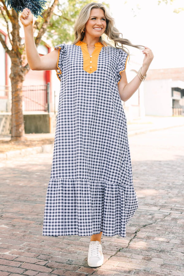 Plus Size navy and white gingham maxi dress with orange ruffle sleeves and a buttoned orange collar.