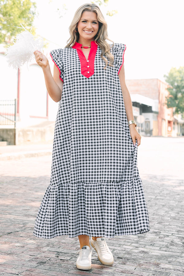 Plus Size black and white gingham maxi dress with red ruffled v-neckline and flutter sleeves.