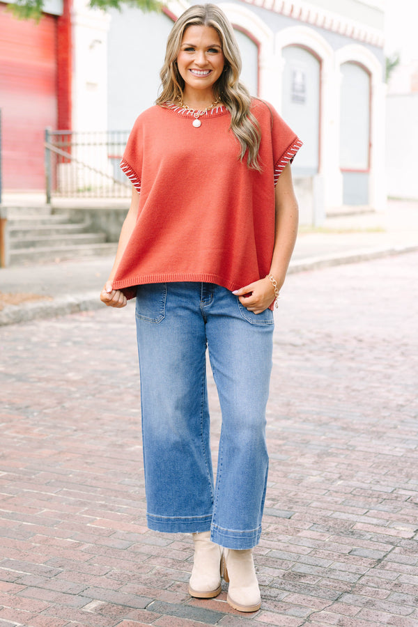 Plus Size medium wash wide-leg cropped jeans with functional pockets and a relaxed fit.