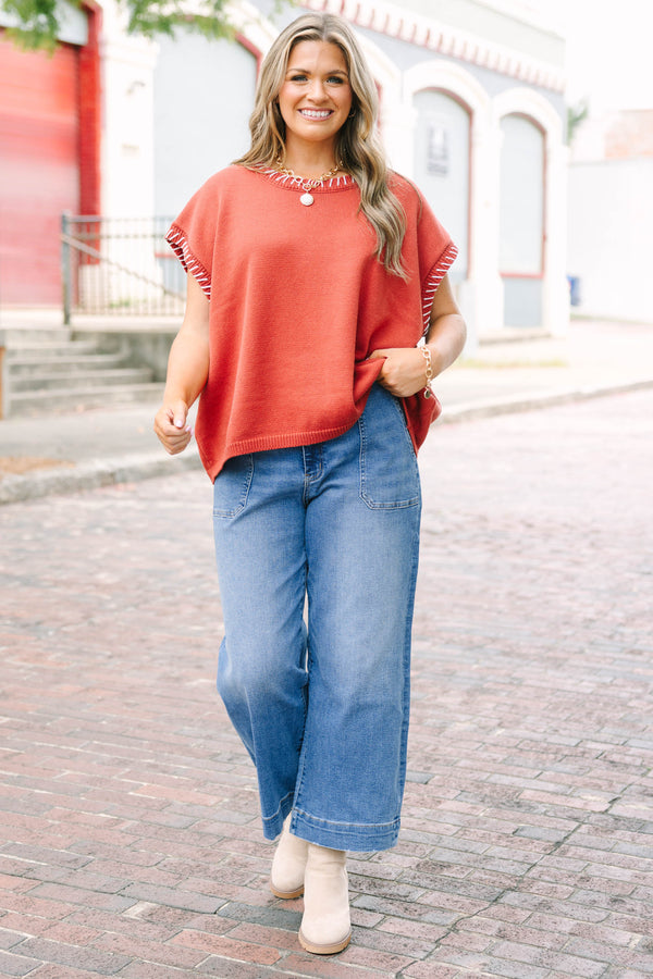 Plus Size medium wash wide-leg cropped jeans with functional pockets and a relaxed fit.