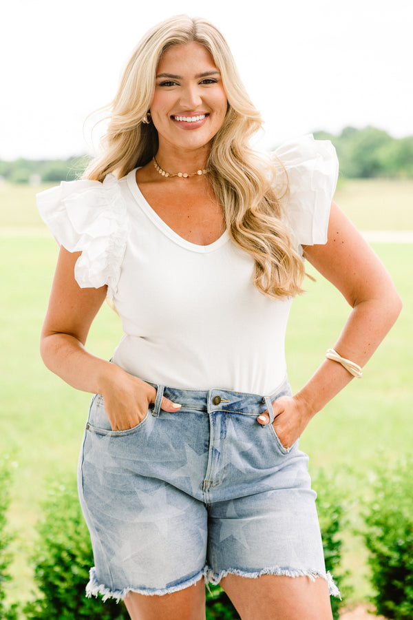 Chic Soul plus size clothing, medium wash denim novelty shorts with faint white star pattern and distressed fringe hem