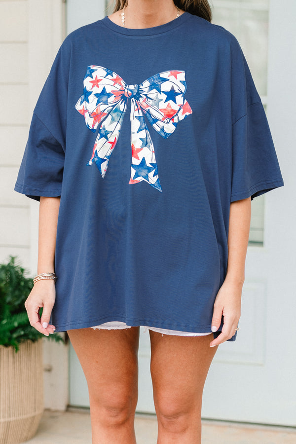 Plus Size navy oversized boyfriend tee with a red, white, and blue starry bow graphic.