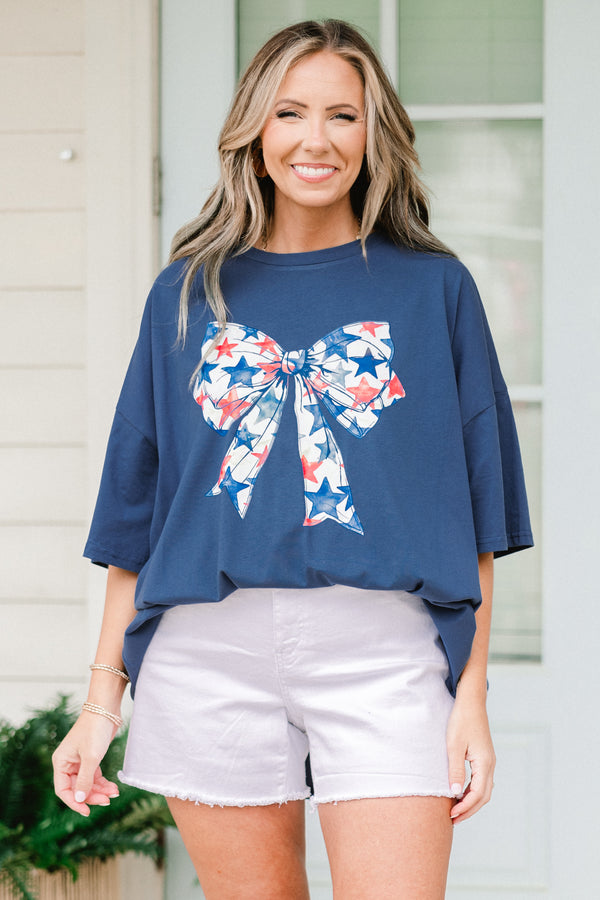 Plus Size navy oversized boyfriend tee with a red, white, and blue starry bow graphic.