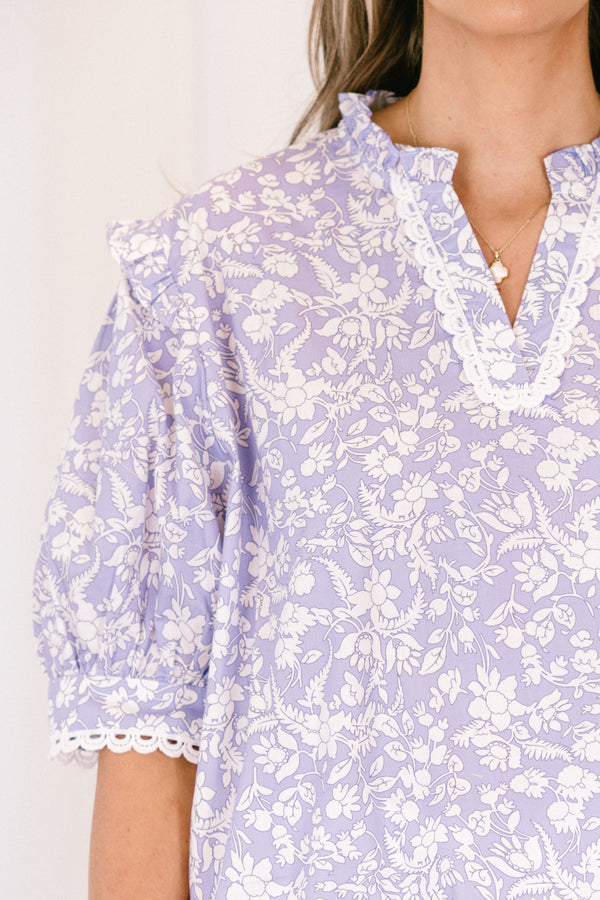 Chic soul plus size clothing, purple blouse with a white floral pattern and bubble sleeves 