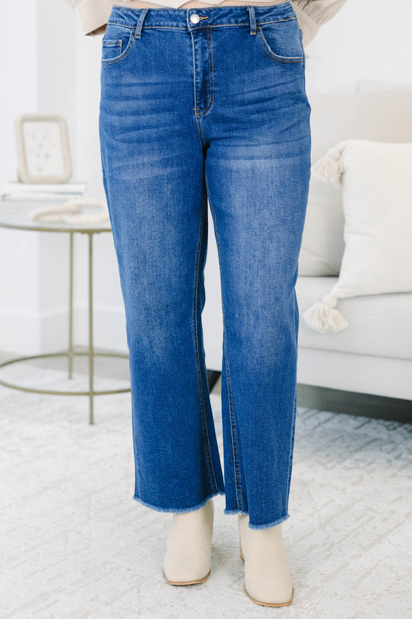 Plus Size dark wash straight leg jeans with a high waist and raw fringe hems.