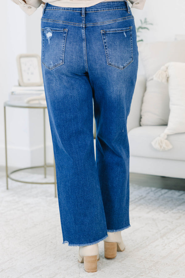 Plus Size dark wash straight leg jeans with a high waist and raw fringe hems.