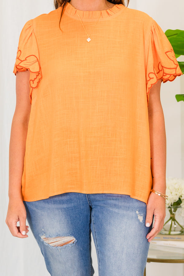 Chic Soul plus size clothing, short sleeve apricot orange top with smocked high neckline and darker orange embroidery on sleeves 
