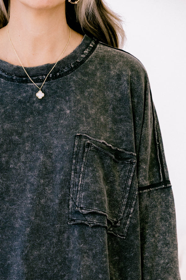 Chic Soul plus size clothing, ash black long sleeve casual top with an acid washed pattern as well as a front pocket and black stitching details on the sleeves and bottom of the shirt  