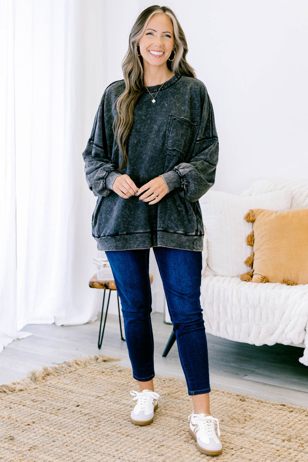 Chic Soul plus size clothing, ash black long sleeve casual top with an acid washed pattern as well as a front pocket and black stitching details on the sleeves and bottom of the shirt  
