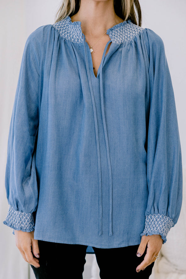 Chic soul plus size clothing, long sleeve flowy denim blouse with white stitching detailing around the collar and cuff of the sleeves, with 2 drawstrings at the collar