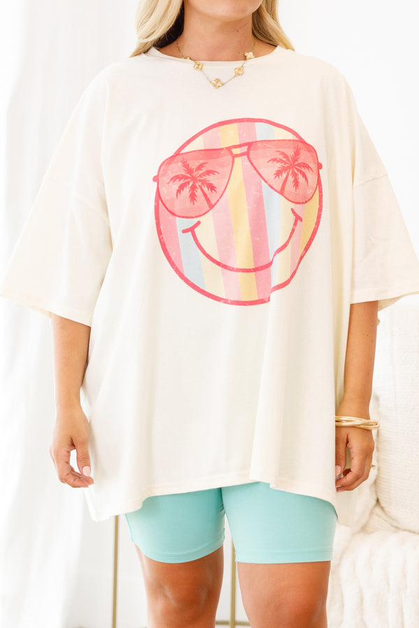 Plus Size ivory oversized boyfriend tee with a striped smiley face and palm tree sunglasses graphic.