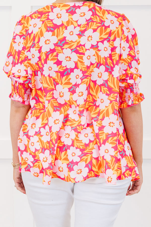 Chic Soul plus size clothing, hot pink short sleeve top with v neckline and smocked cuff sleeves with large multi floral print