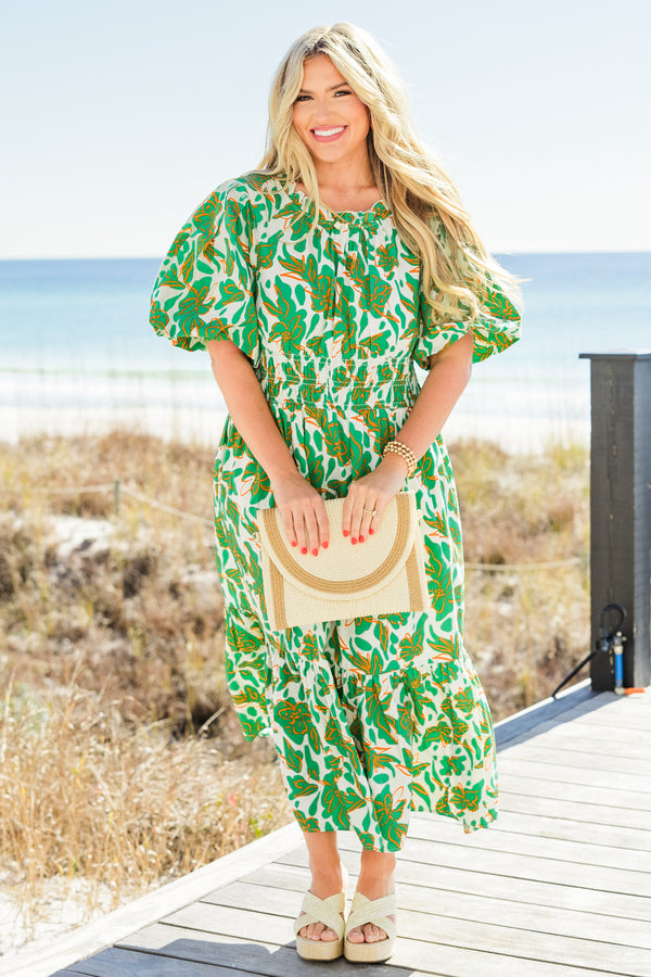 Chic Soul plus size clothing, short-puffed-sleeve green maxi dress with a scoop-neckline and smocked detailing on the waistline with a green and white tropical floral pattern 