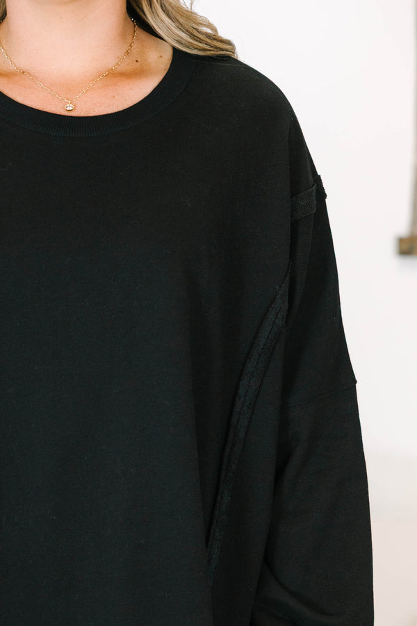 Plus size Sunset Glow Pullover in black, featuring a relaxed fit, crew neck, and raw seam details.