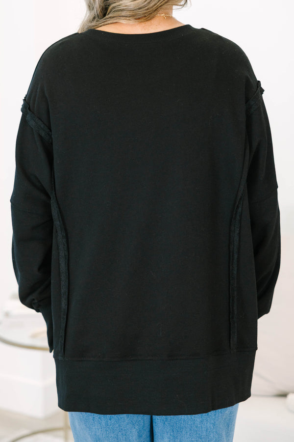 Plus size Sunset Glow Pullover in black, featuring a relaxed fit, crew neck, and raw seam details.