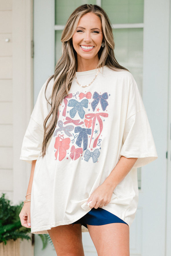 Chic Soul plus size clothing, short-sleeve ivory white boyfriend tee with a high-scoop-neckline and a red and blue faded graphic of different kinds of bows