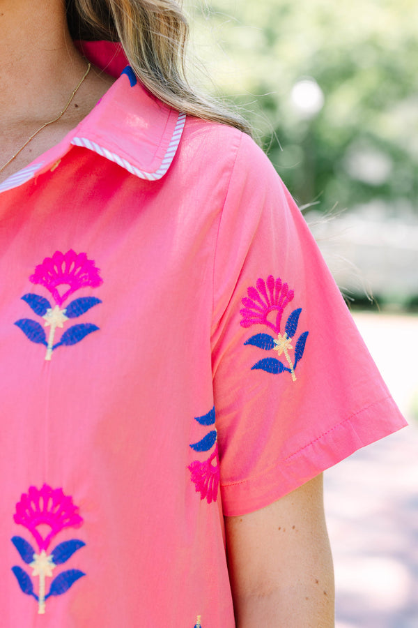 Plus Size pink button-down shirt dress with blue and magenta floral embroidery and short sleeves.