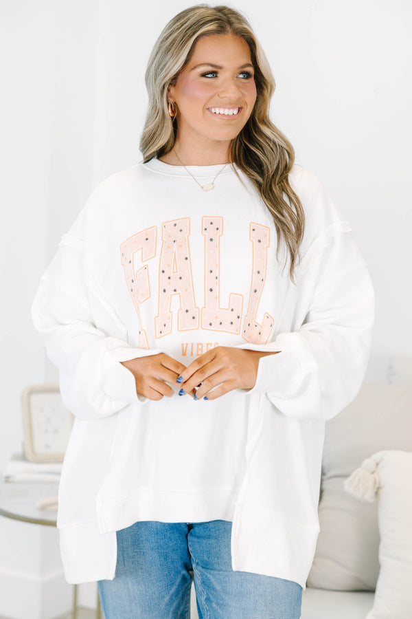 Plus Size ivory oversized crewneck sweatshirt with peach 'FALL VIBES' graphic and star details.