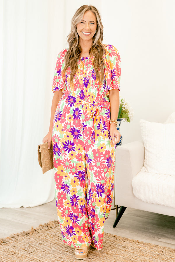 chic soul plus size clothing, Pink jumpsuit with a multi-color floral pattern and a belt that ties around the waist 