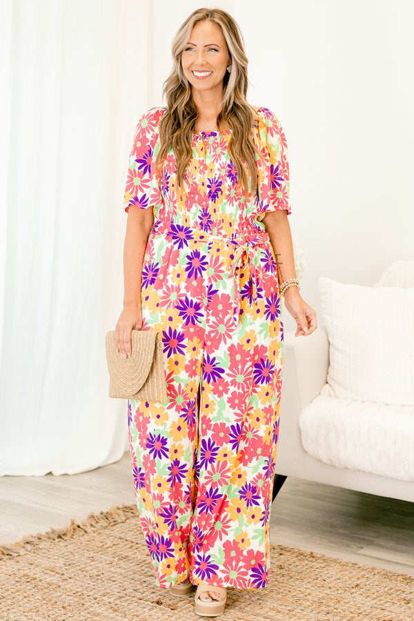chic soul plus size clothing, Pink jumpsuit with a multi-color floral pattern and a belt that ties around the waist 