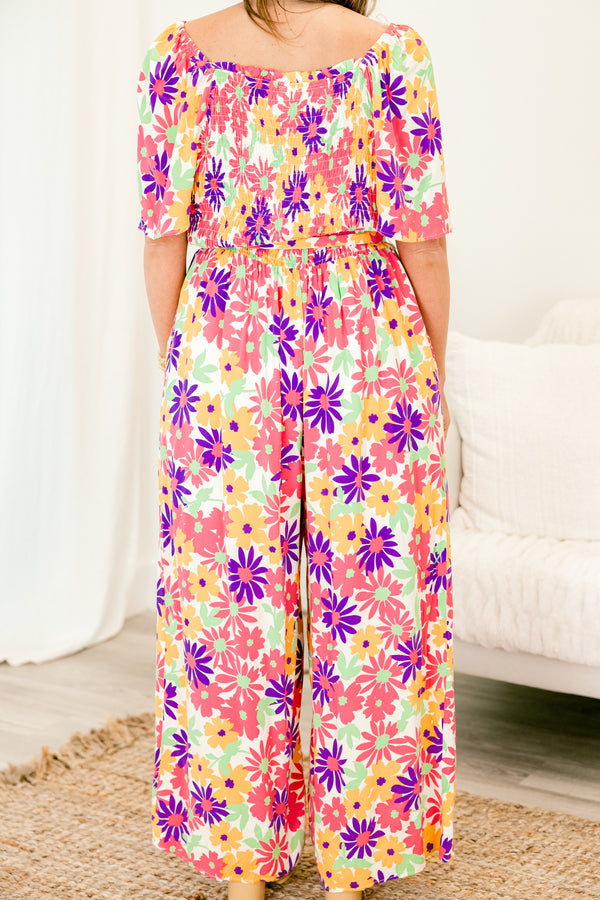 chic soul plus size clothing, Pink jumpsuit with a multi-color floral pattern and a belt that ties around the waist 
