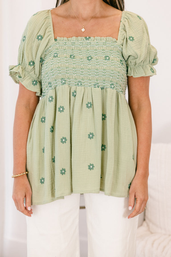 Chic Soul plus size clothing, short-sleeve ruffled puffed flowy pale sage green baby doll top with a square-neckline and a smocked bodice with a darker green subtle floral pattern 