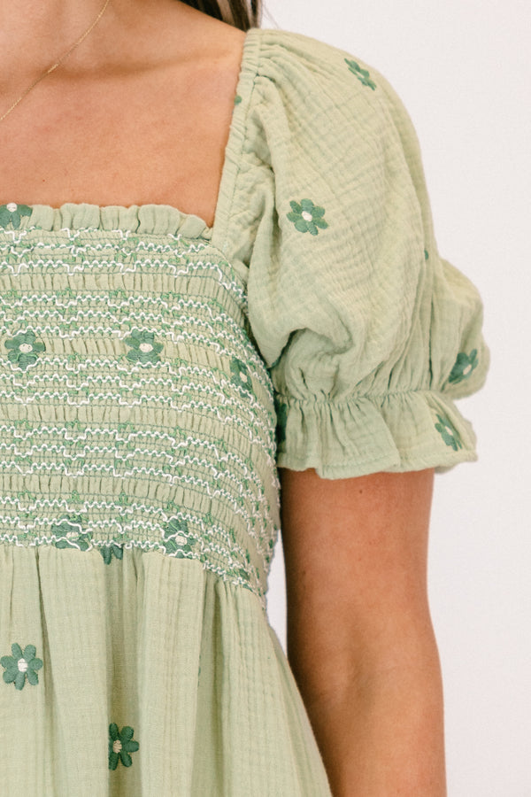 Chic Soul plus size clothing, short-sleeve ruffled puffed flowy pale sage green baby doll top with a square-neckline and a smocked bodice with a darker green subtle floral pattern 