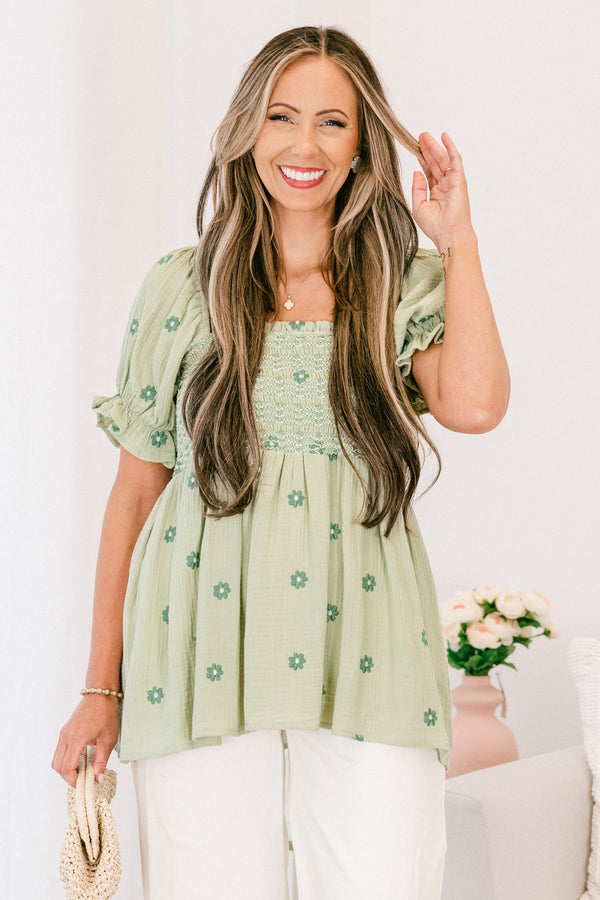Chic Soul plus size clothing, short-sleeve ruffled puffed flowy pale sage green baby doll top with a square-neckline and a smocked bodice with a darker green subtle floral pattern 