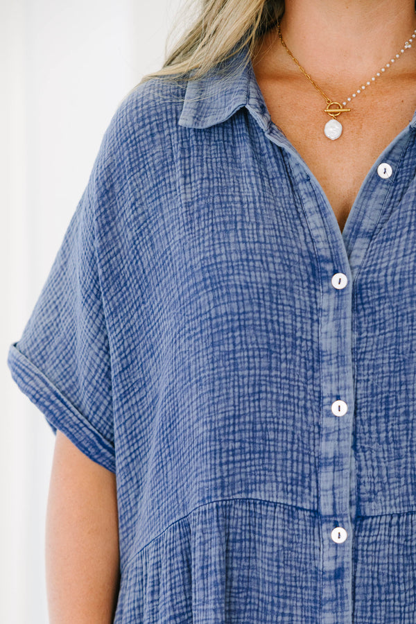 Plus size navy blue, flowy tiered maxi dress with a button-down front and short sleeves.