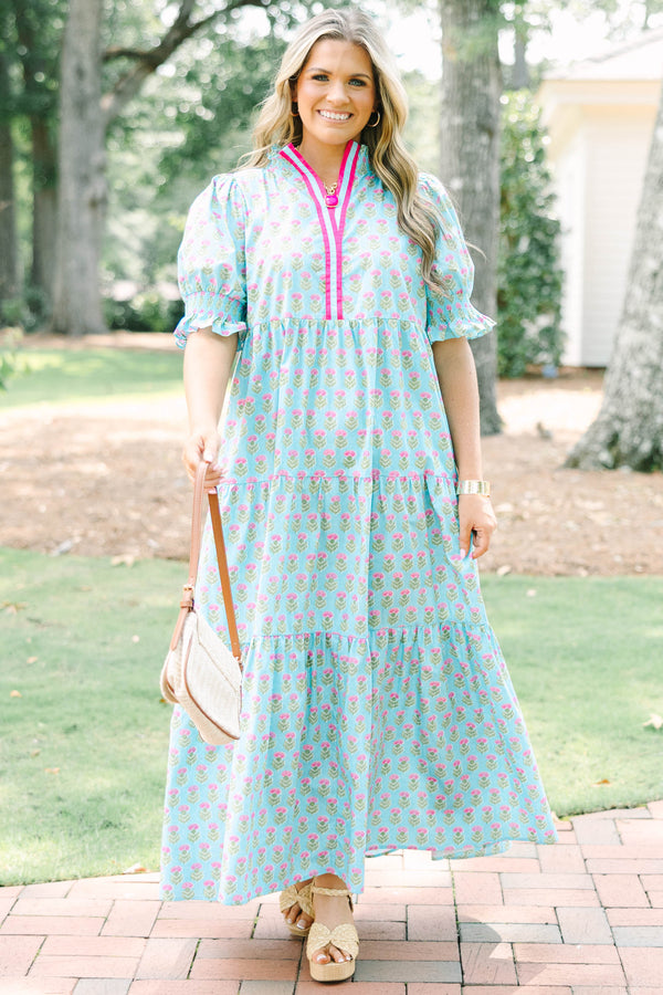 Plus size baby blue tiered maxi dress with pink floral print, ruffle sleeves, and a flowy fit.