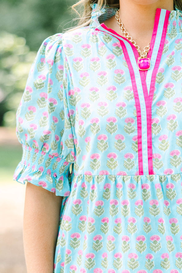 Plus size baby blue tiered maxi dress with pink floral print, ruffle sleeves, and a flowy fit.