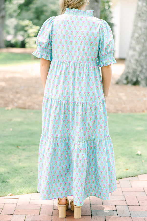Plus size baby blue tiered maxi dress with pink floral print, ruffle sleeves, and a flowy fit.