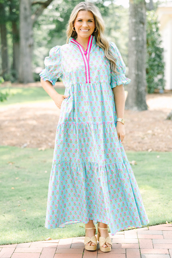 Plus size baby blue tiered maxi dress with pink floral print, ruffle sleeves, and a flowy fit.