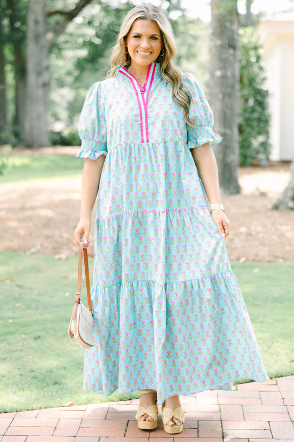 Plus size baby blue tiered maxi dress with pink floral print, ruffle sleeves, and a flowy fit.