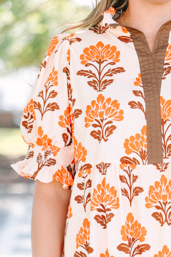 Plus Size orange floral tiered maxi dress with puff sleeves and a brown button-down neckline.