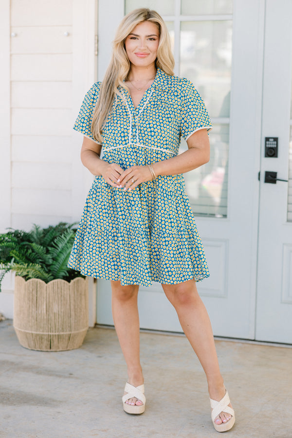 Chic Soul plus size clothing, short-sleeve collared teal mix baby doll dress with a white piping along the sleeves and bodice and a teal and yellow abstract spotted floral pattern 