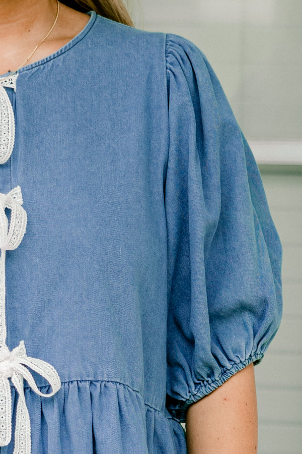 Chic Soul plus size clothing, denim top with three bows going down the  center of the shirt and bubble sleeves 