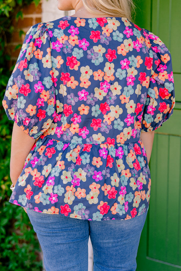 Chic Soul Plus size clothing, navy floral peplum top with bubble sleeves and three bows going down the center of the shirt 
