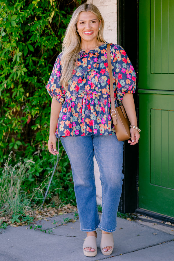 Chic Soul Plus size clothing, navy floral peplum top with bubble sleeves and three bows going down the center of the shirt 
