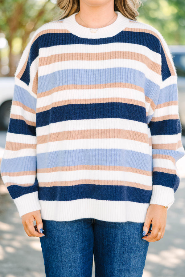 Plus Size oversized crewneck sweater with horizontal stripes in navy, light blue, tan, and white.