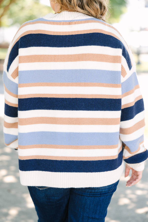 Plus Size oversized crewneck sweater with horizontal stripes in navy, light blue, tan, and white.