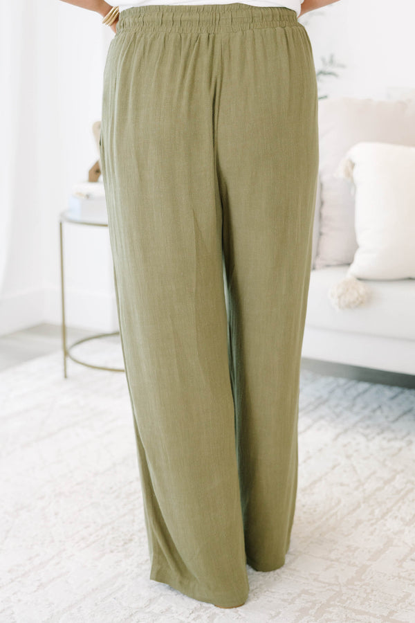 Plus Size olive green wide-leg pants with a drawstring elastic waistband and textured fabric.