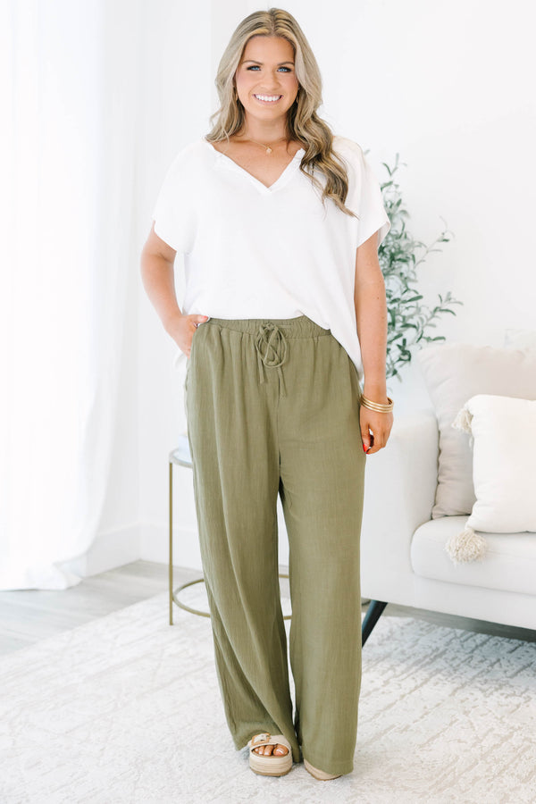 Plus Size olive green wide-leg pants with a drawstring elastic waistband and textured fabric.