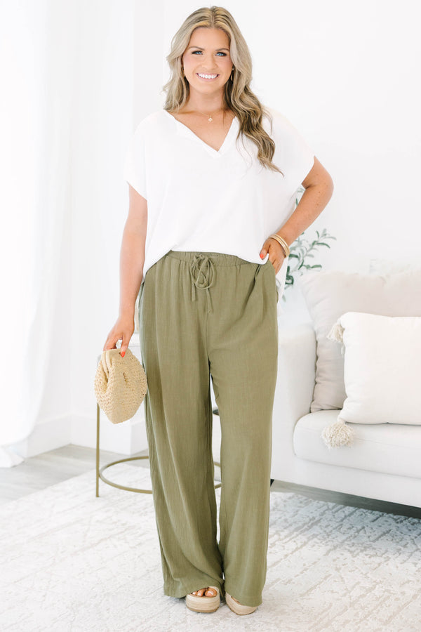 Plus Size olive green wide-leg pants with a drawstring elastic waistband and textured fabric.