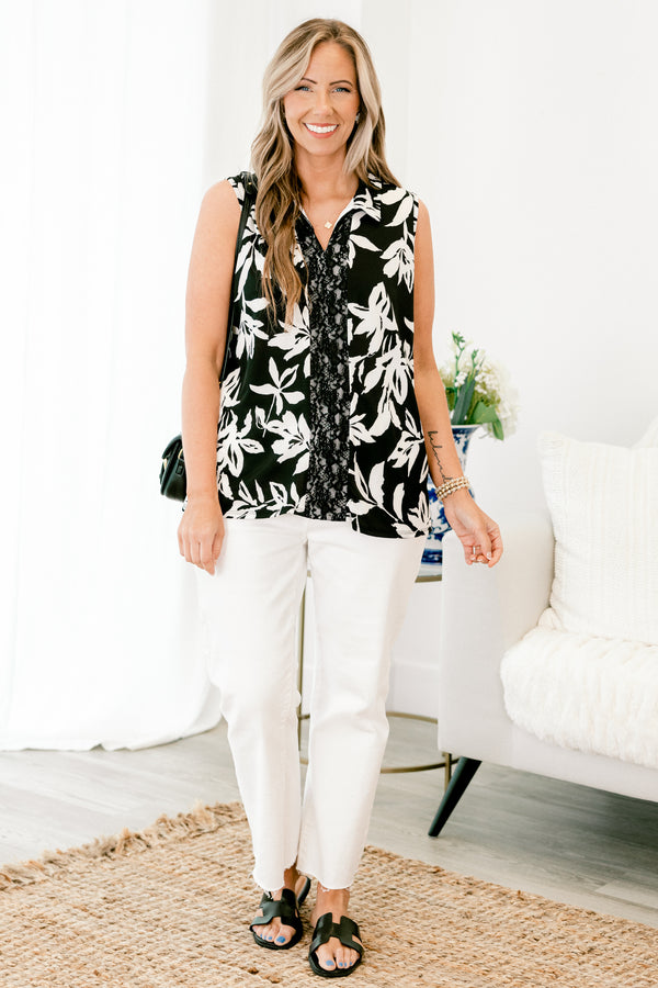 chic soul plus size clothing, black tank with a white floral pattern and a black lace strip down the center of the shir, it has a slight v-neckline 
