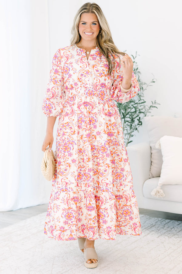 Plus Size pink and orange paisley print tiered maxi dress with puff sleeves and a button neckline.