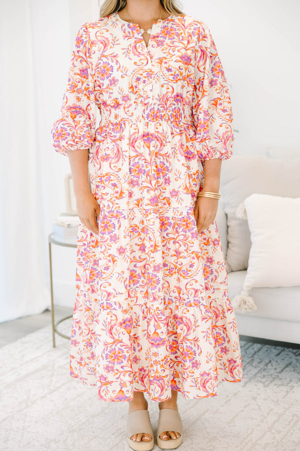 Plus Size pink and orange paisley print tiered maxi dress with puff sleeves and a button neckline.